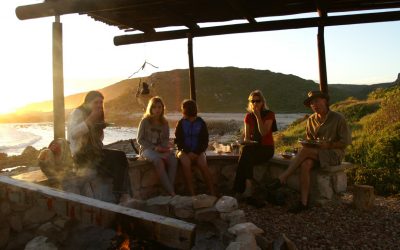 Hikers having sundowners in the Noetsie boma on the Whale Trail Adventures